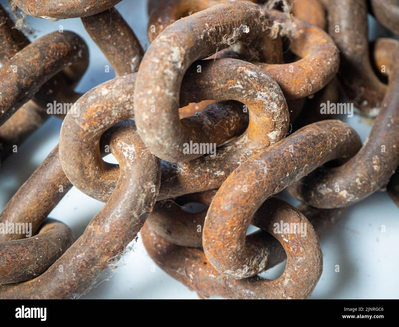 old rusted steel chains. Concept of antiquity and false security Stock Photo Alamy