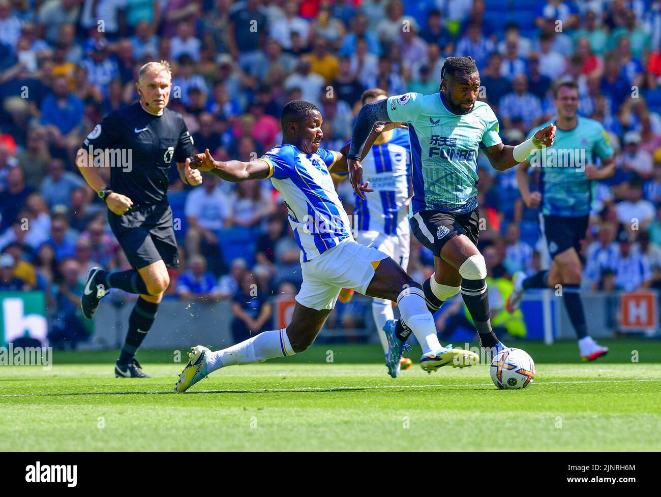 Brighton, UK. 13th Aug, 2022. Moises Caicedo of Brighton and Hove Albion and Allan Saint-Maximin of Newcastle United during the Premier League match between Brighton & Hove Albion and Newcastle United at The Amex on August 13th 2022 in Brighton, England. (Photo by Jeff Mood/phcimages.com) Credit: PHC Images/Alamy Live News Stock Photo