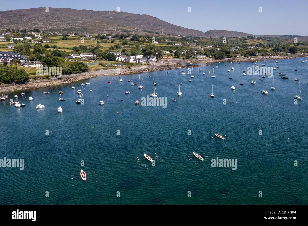 Schull, West Cork, Ireland. 13th Aug, 2022. The 2022 Irish Coastal Rowing Championships is taking place this weekend in Schull, West Cork. A total of 290 crews from different clubs are taking part in the event which finishes Sunday evening. The racing took place under the gaze of Mount Gabriel. Credit: AG News/Alamy Live News Stock Photo
