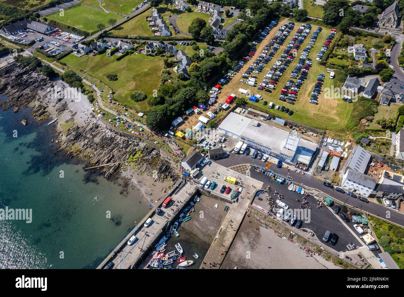 Schull, West Cork, Ireland. 13th Aug, 2022. The 2022 Irish Coastal Rowing Championships is taking place this weekend in Schull, West Cork. A total of 290 crews from different clubs are taking part in the event which finishes Sunday evening. Hundreds of spectators crowded the banks of Schull bay to watch the action. Credit: AG News/Alamy Live News Stock Photo
