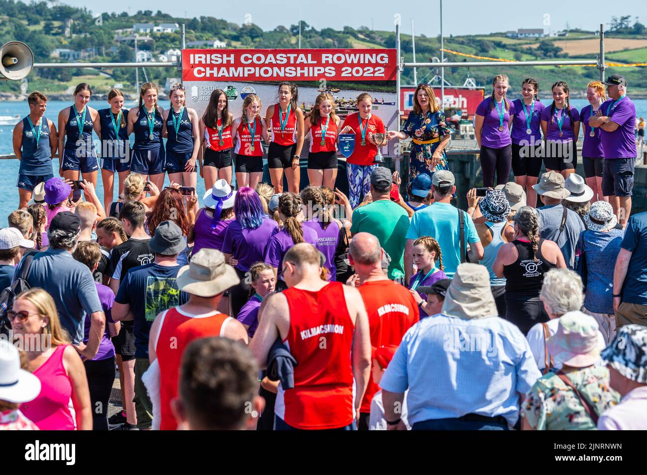 Schull, West Cork, Ireland. 13th Aug, 2022. The 2022 Irish Coastal Rowing Championships is taking place this weekend in Schull, West Cork. A total of 290 crews from different clubs are taking part in the event which finishes Sunday evening. Presentations took place on Schull Pier and drew a big crowd of spectators. Credit: AG News/Alamy Live News Stock Photo