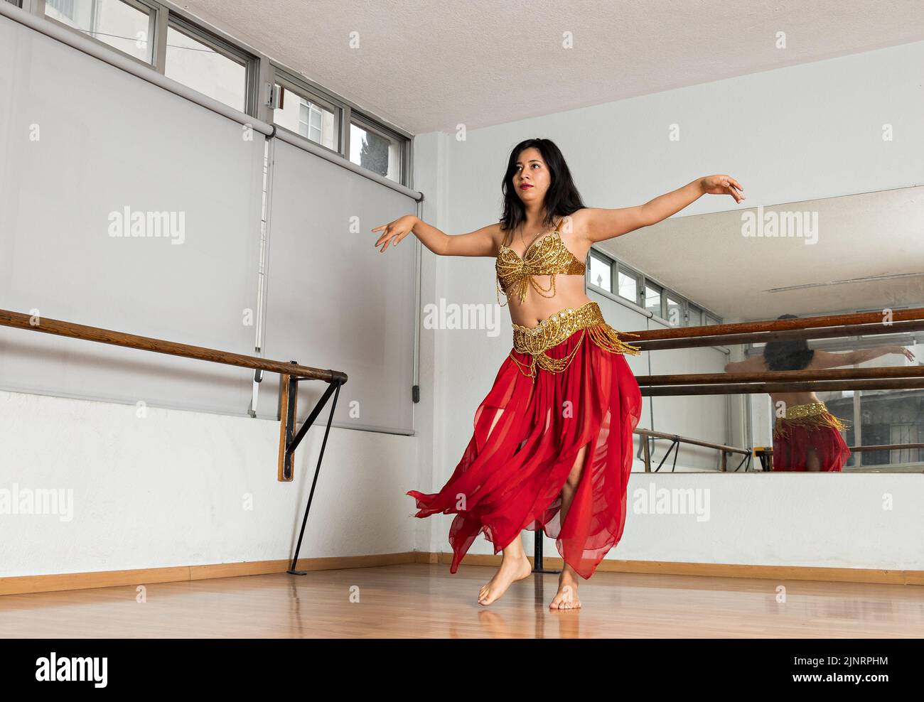 Belly dancer in red hi-res stock photography and images - Alamy
