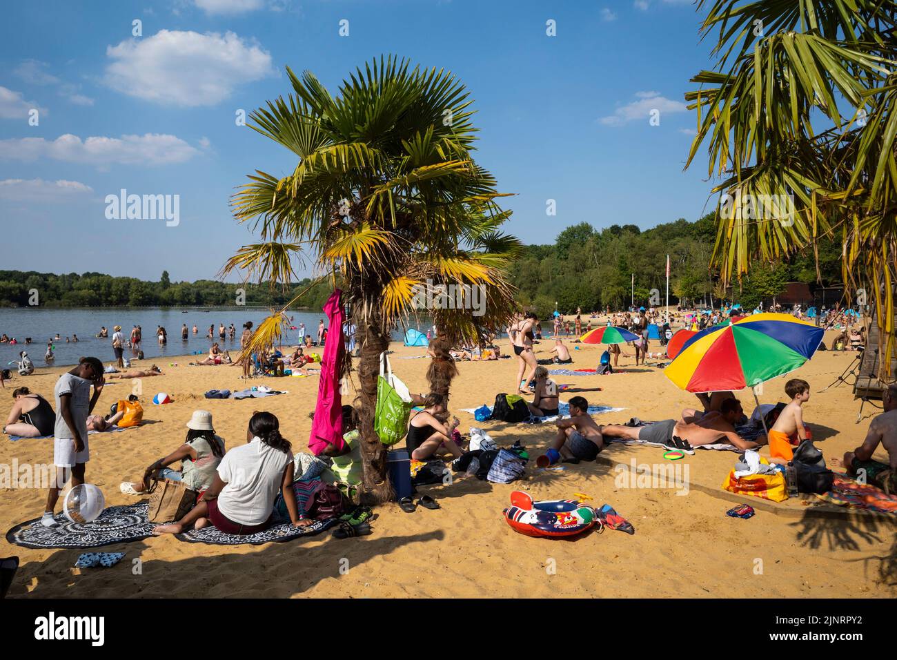 London, UK.  13 August 2022.  UK Weather - People enjoy the sunshine and hot weather at Ruislip Lido in north west London with temperatures forecast to rise to 34C in the south east.  The driest spell in England for 46 years continues and many parts of the country are now officially ‘in drought’ according to the Environment Agency.  Credit: Stephen Chung / Alamy Live News Stock Photo