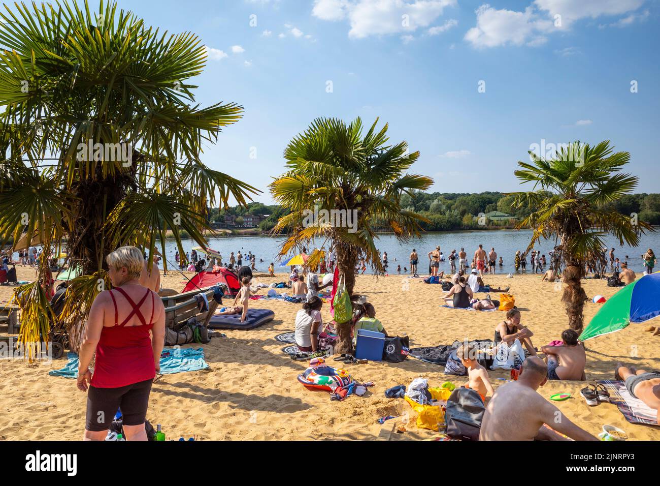 London, UK.  13 August 2022.  UK Weather - People enjoy the sunshine and hot weather at Ruislip Lido in north west London with temperatures forecast to rise to 34C in the south east.  The driest spell in England for 46 years continues and many parts of the country are now officially ‘in drought’ according to the Environment Agency.  Credit: Stephen Chung / Alamy Live News Stock Photo