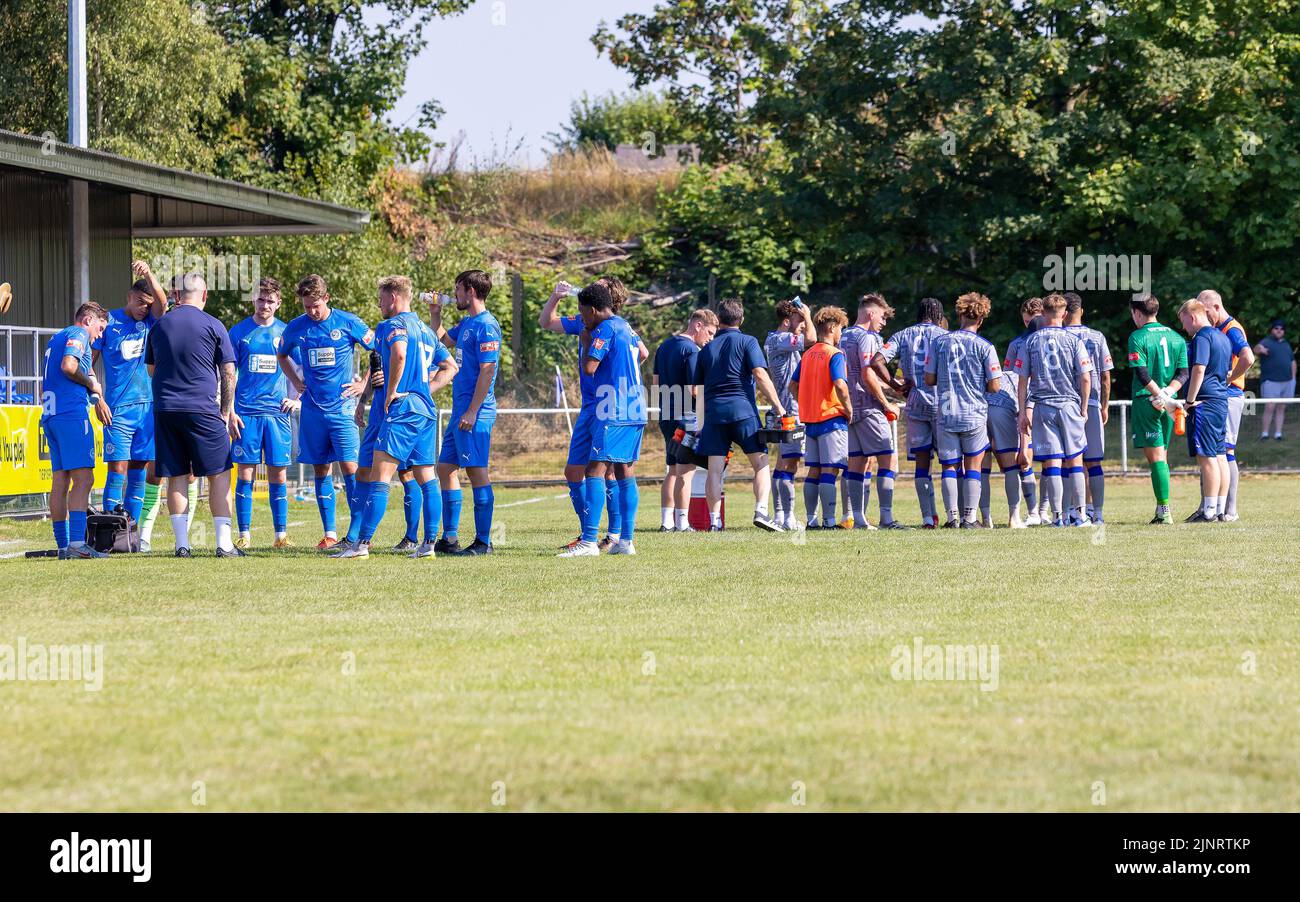 Gorsey Lane, Warrington, Cheshire, UK. 18th Aug, 2022. The first match of the 2022-23 season gets underway in a heatwave and both sides took time out to take on liquid to re-hydrate. Both Managers took this opportunity to talk tactics to their players Credit: John Hopkins/Alamy Live News Stock Photo