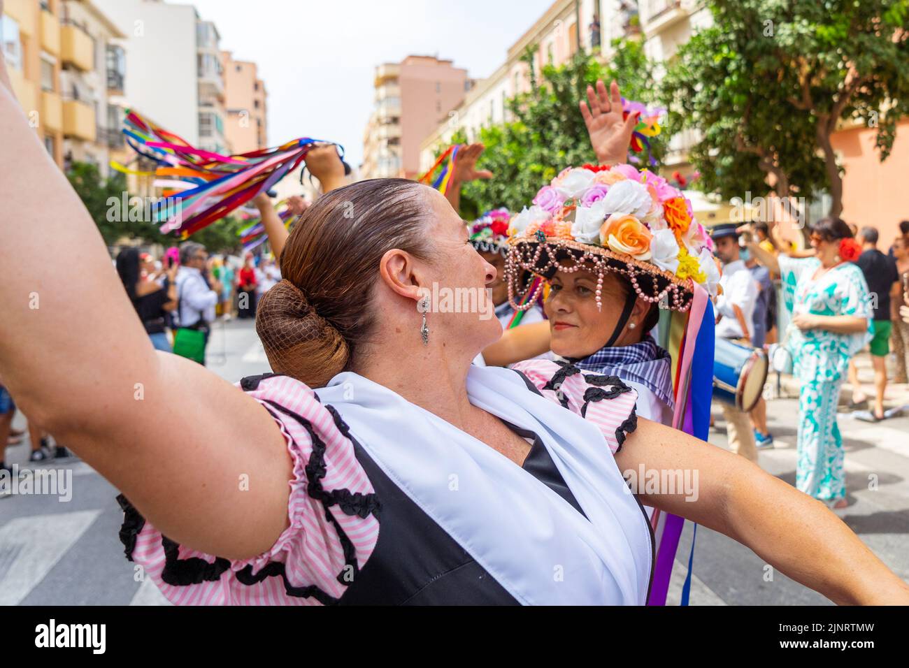 Two women seen dancing 'verdiales' during the first day of Malaga's Fair 2022. The Fair is being held for the first time since 2019. The 2020 and 2021 editions were suspended due to Covid19 pandemic. Stock Photo