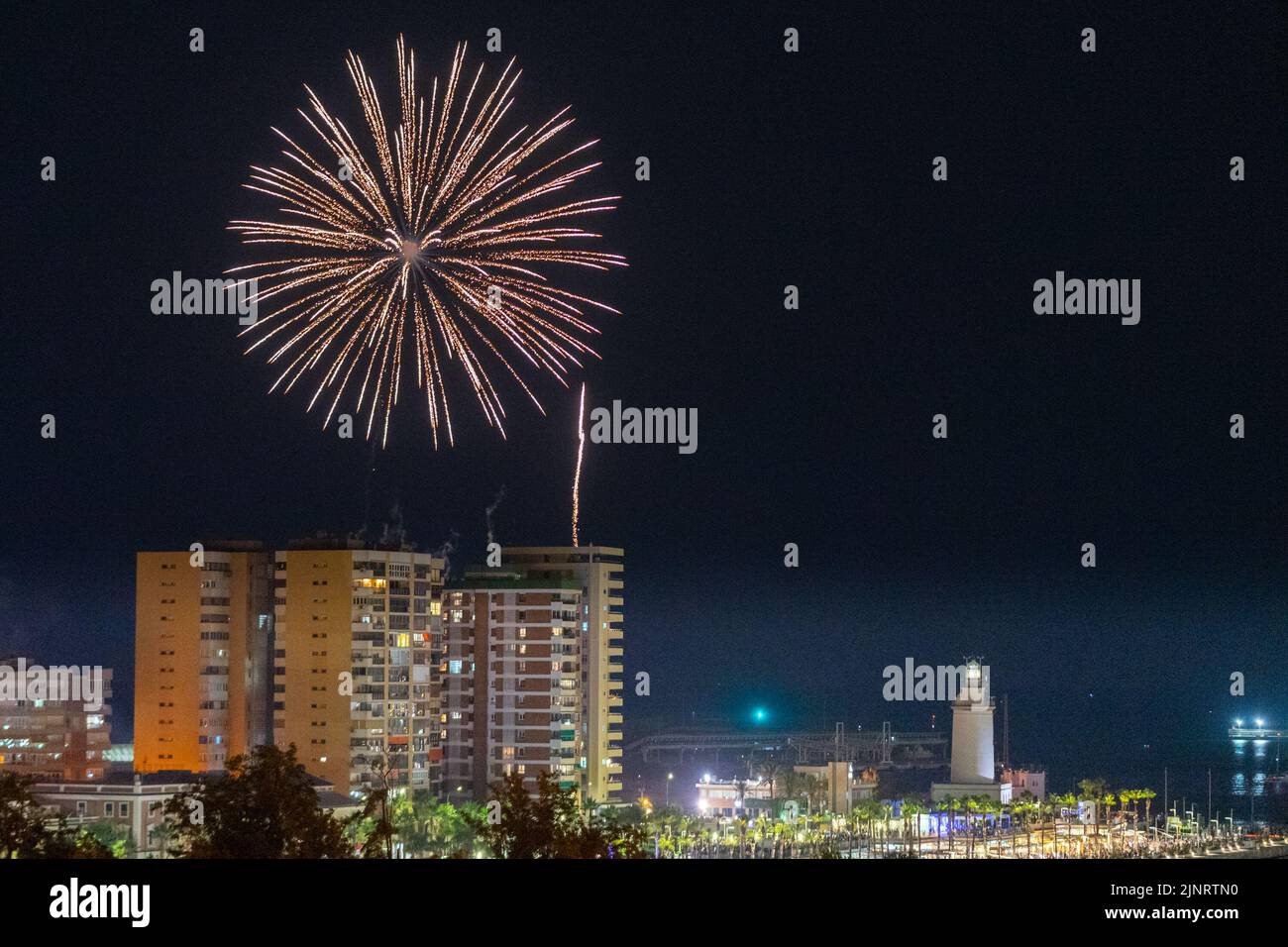 Panoramic view of fireworks at Malaga Cruise Port in Malaga due to the inauguration of Malaga's Fair 2022 The Fair is being held for the first time since 2019. The 2020 and 2021 editions were suspended due to Covid19 pandemic. Stock Photo