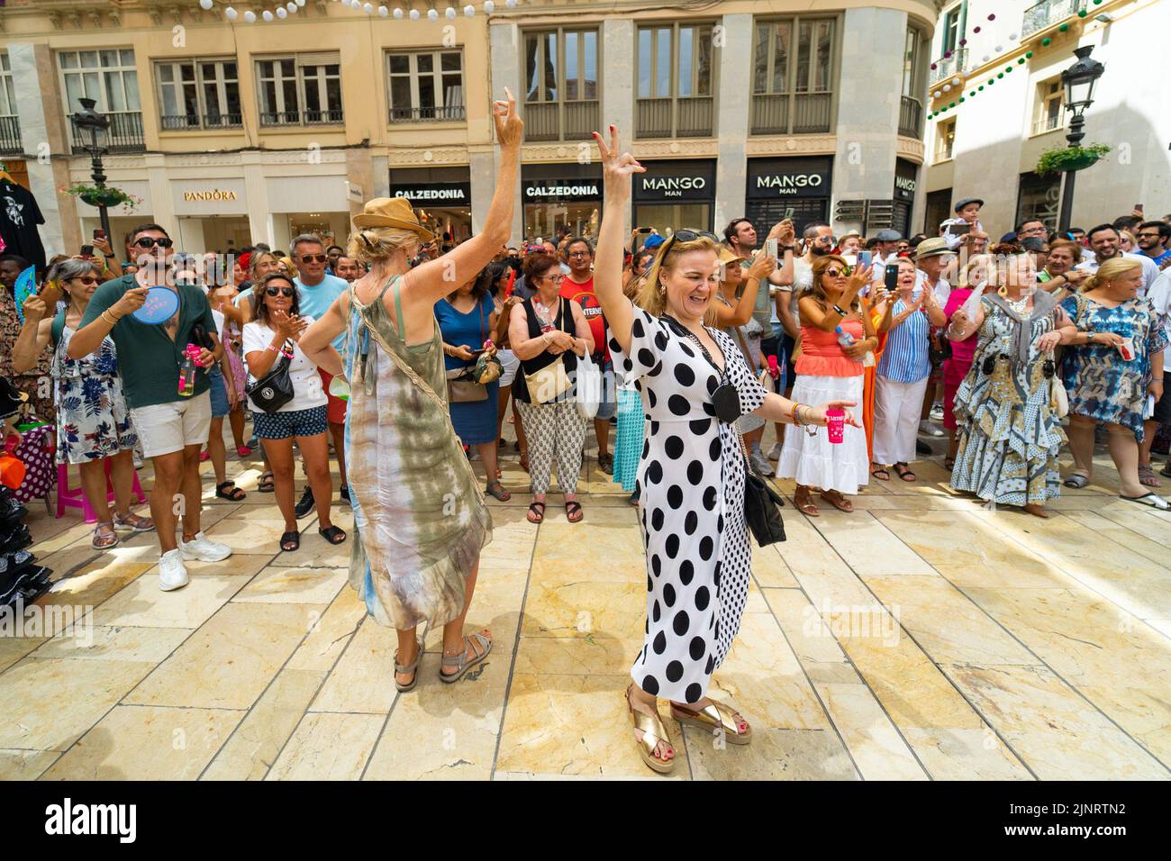People seen dancing flamenco on the street during the first day of Malaga's Fair 2022. The Fair is being held for the first time since 2019. The 2020 and 2021 editions were suspended due to Covid19 pandemic. Stock Photo