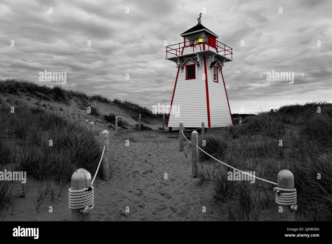 Black and White image with selective color of Covehead Hourbour Lighthouse on Prince Edward Island Canada Stock Photo