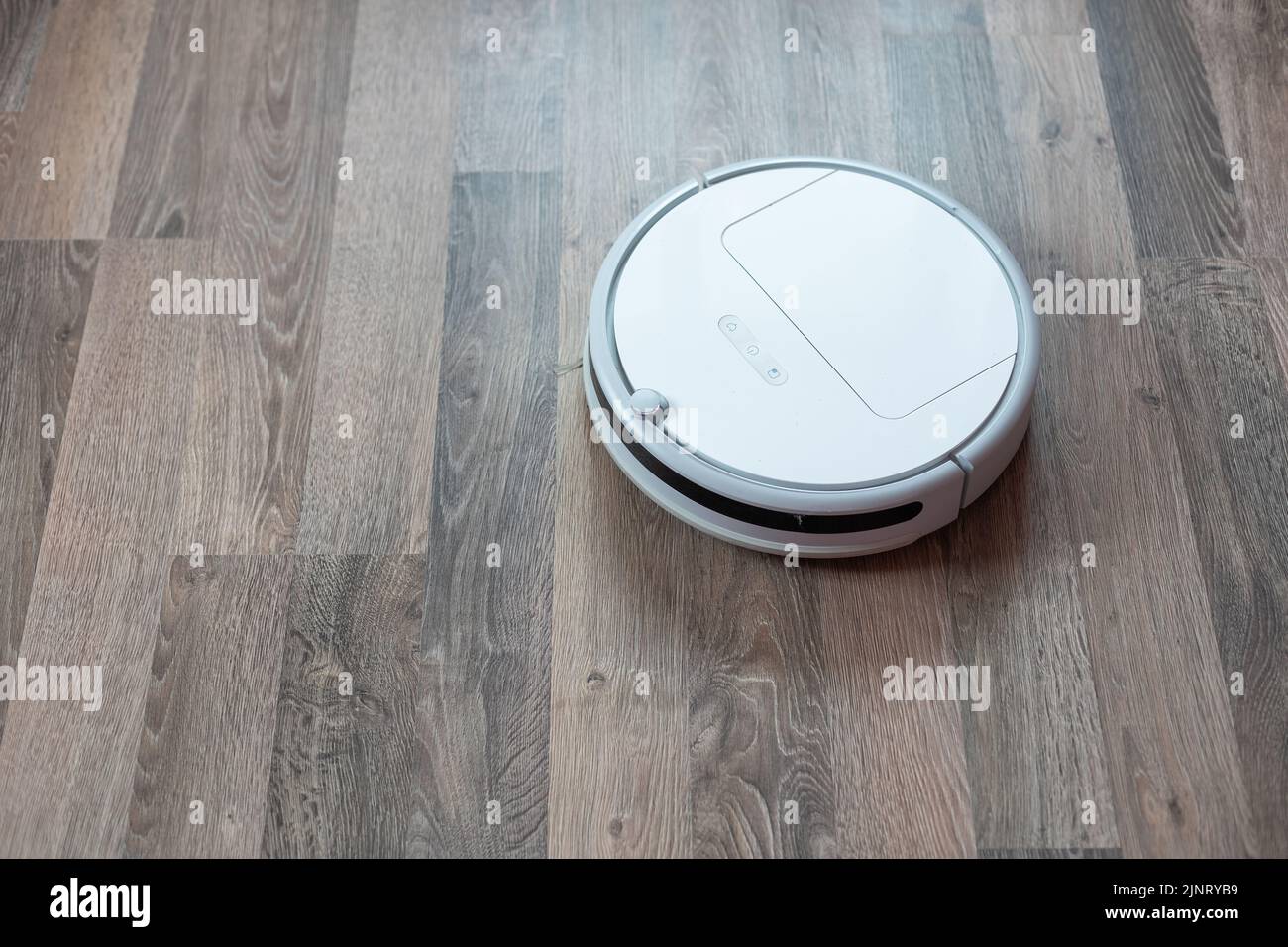 robotic vacuum cleaner on laminate wood floor smart cleaning technology