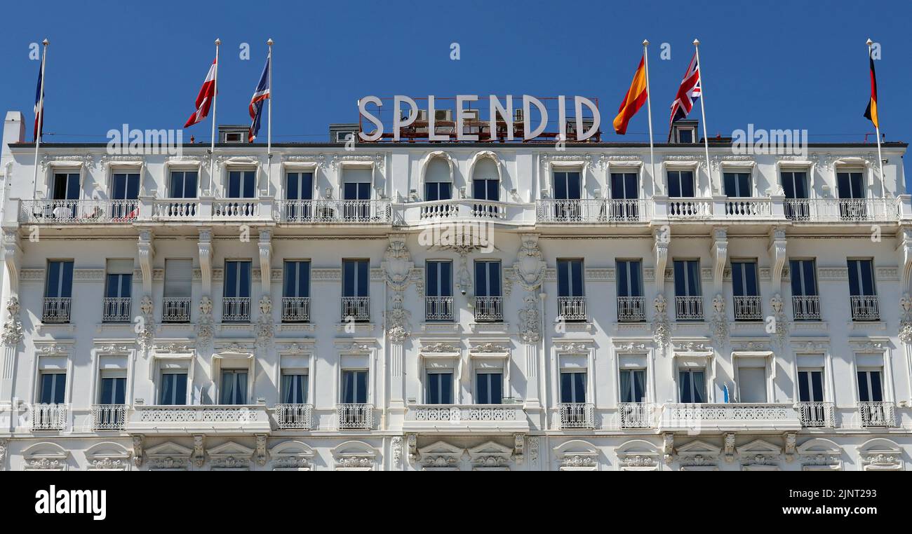 A view of the exterior of the Belle Époque Hotel Splendid, Cannes, South of France, against an azure blue sky. Stock Photo