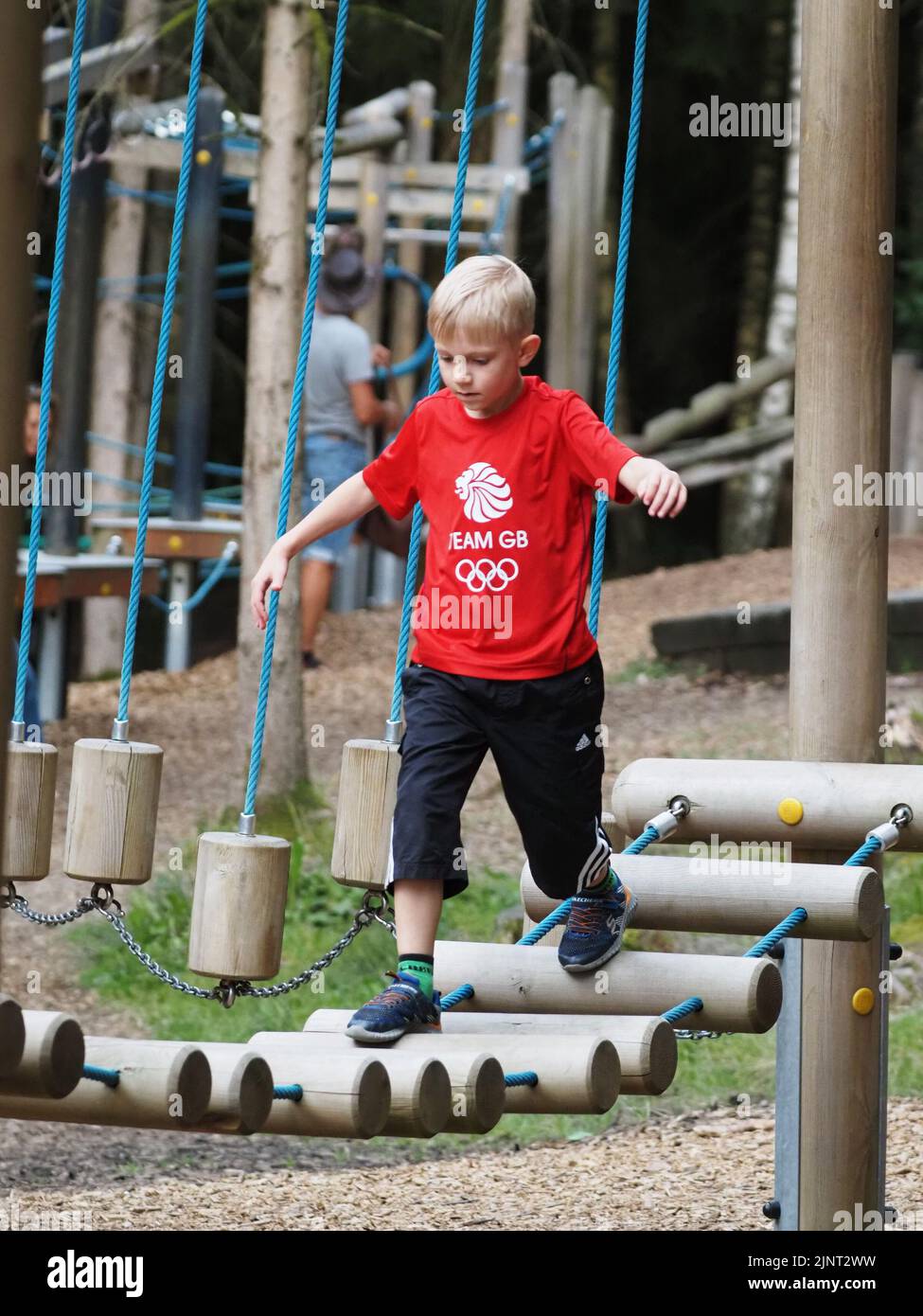 A boy walks a children's obstacle course in Pullman City Stock Photo