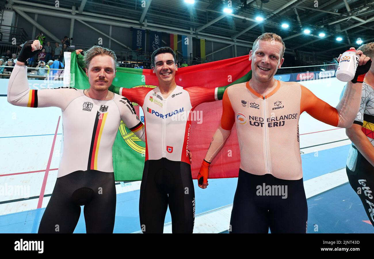 Munich, Germany. 13th Aug, 2022. European Championships, European Championship, Track, Scratch, Men, Messe München. Moritz Malcharek (Germany, 2nd place, l-r), Portugal's Iuri Leitao (1st place) and Roy Eefting from the Netherlands cheer about their placings. Credit: Angelika Warmuth/dpa/Alamy Live News Stock Photo