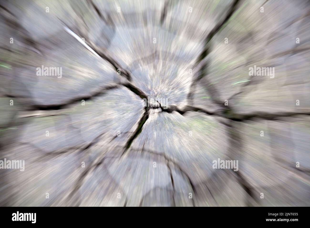 A ICM photo looking down at the cracks in the mud at the Snake Pass end of the Ladybower reservoir, Peak district, UK Stock Photo