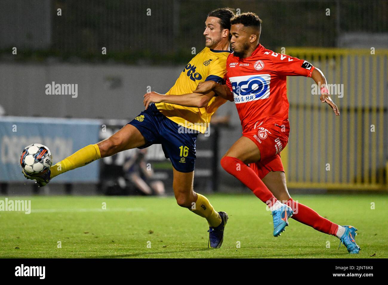 Kortrijk's David Henen and Union's Christian Burgess fight for the ball during a soccer match between RUSG Royale Union Saint-Gilloise and KV Kortrijk, Saturday 13 August 2022 in Forest-Vorst, Brussels, on day 4 of the 2022-2023 'Jupiler Pro League' first division of the Belgian championship. BELGA PHOTO LAURIE DIEFFEMBACQ Stock Photo