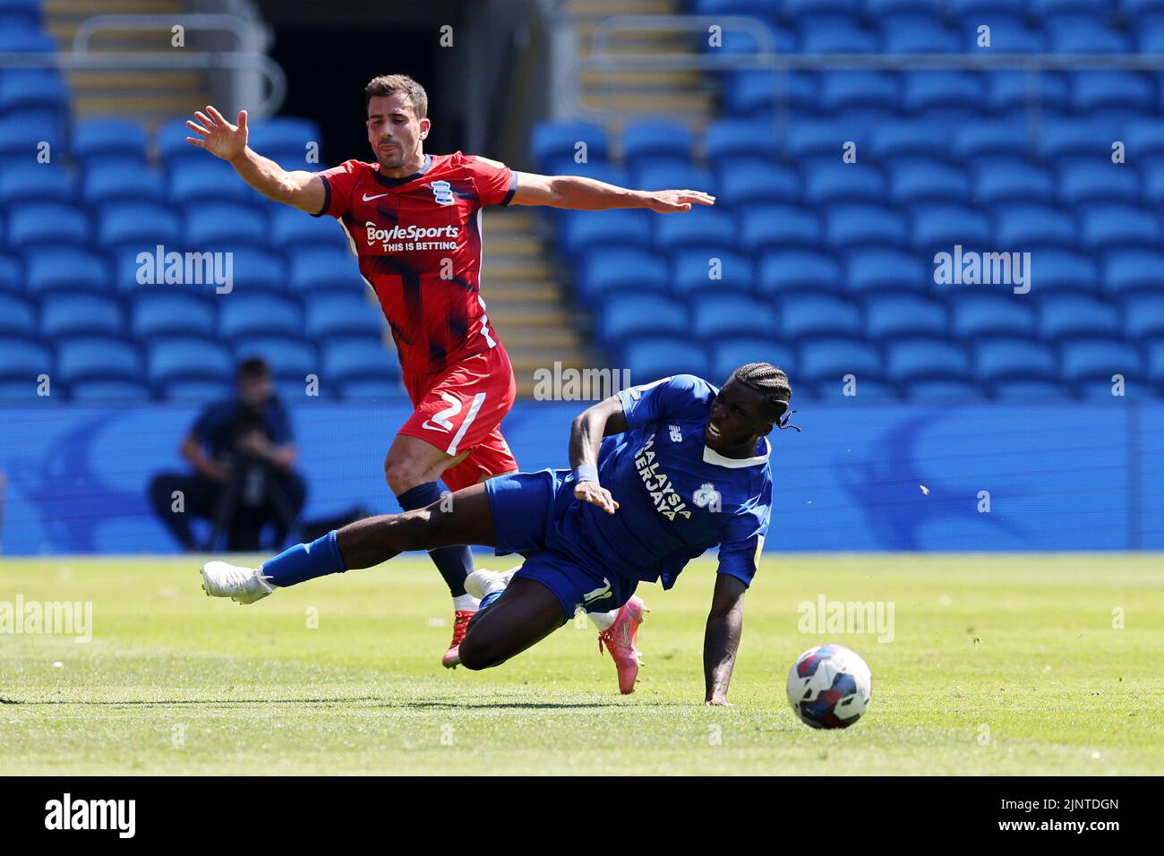 Cardiff, UK. 13th Aug, 2022. Sheyi Ojo of Cardiff City is fouled by Maxime Colin of Birmingham City (l). EFL Skybet championship match, Cardiff city v Birmingham City at the Cardiff City Stadium in Cardiff, Wales on Saturday 13th August 2022. this image may only be used for Editorial purposes. Editorial use only, license required for commercial use. No use in betting, games or a single club/league/player publications. pic by Andrew Orchard/Andrew Orchard sports photography/Alamy Live news Credit: Andrew Orchard sports photography/Alamy Live News Stock Photo