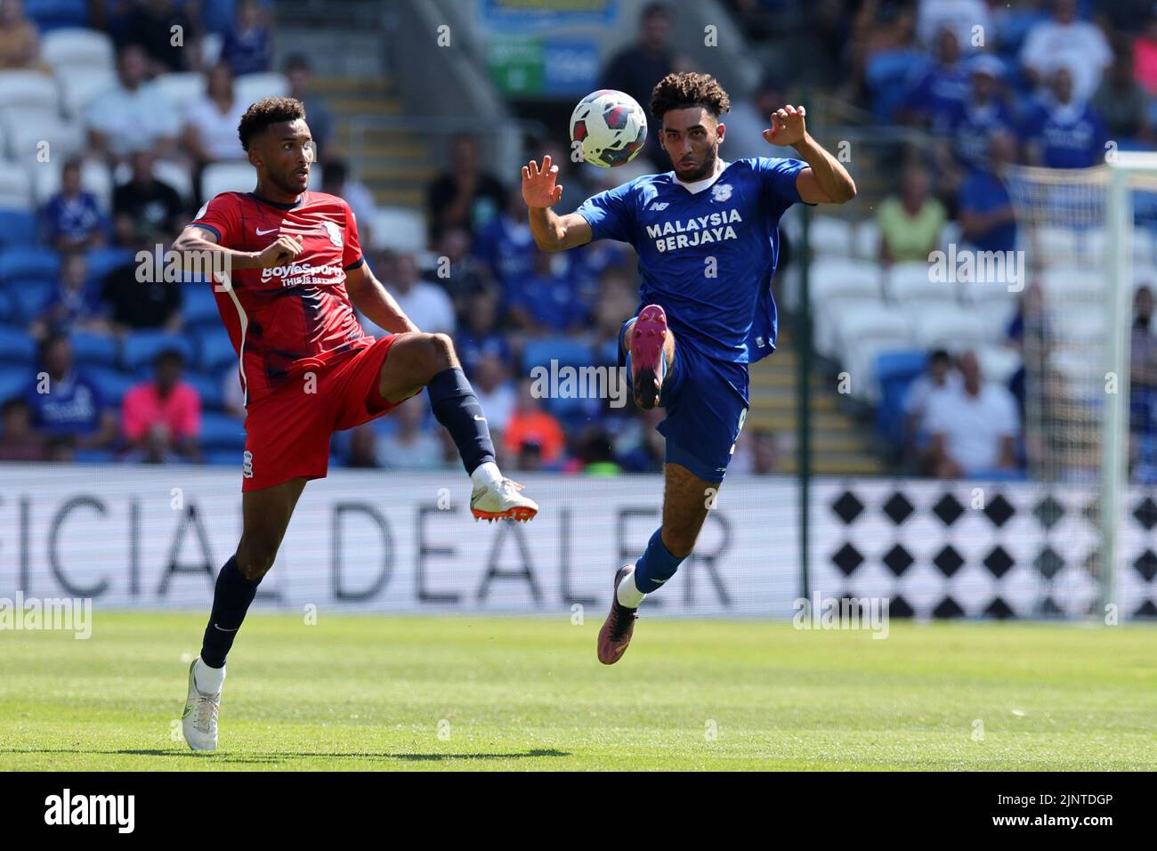 Cardiff, UK. 13th Aug, 2022. Kion Etete of Cardiff City (r) & Auston Trusty of Birmingham City in action . EFL Skybet championship match, Cardiff city v Birmingham City at the Cardiff City Stadium in Cardiff, Wales on Saturday 13th August 2022. this image may only be used for Editorial purposes. Editorial use only, license required for commercial use. No use in betting, games or a single club/league/player publications. pic by Andrew Orchard/Andrew Orchard sports photography/Alamy Live news Credit: Andrew Orchard sports photography/Alamy Live News Stock Photo