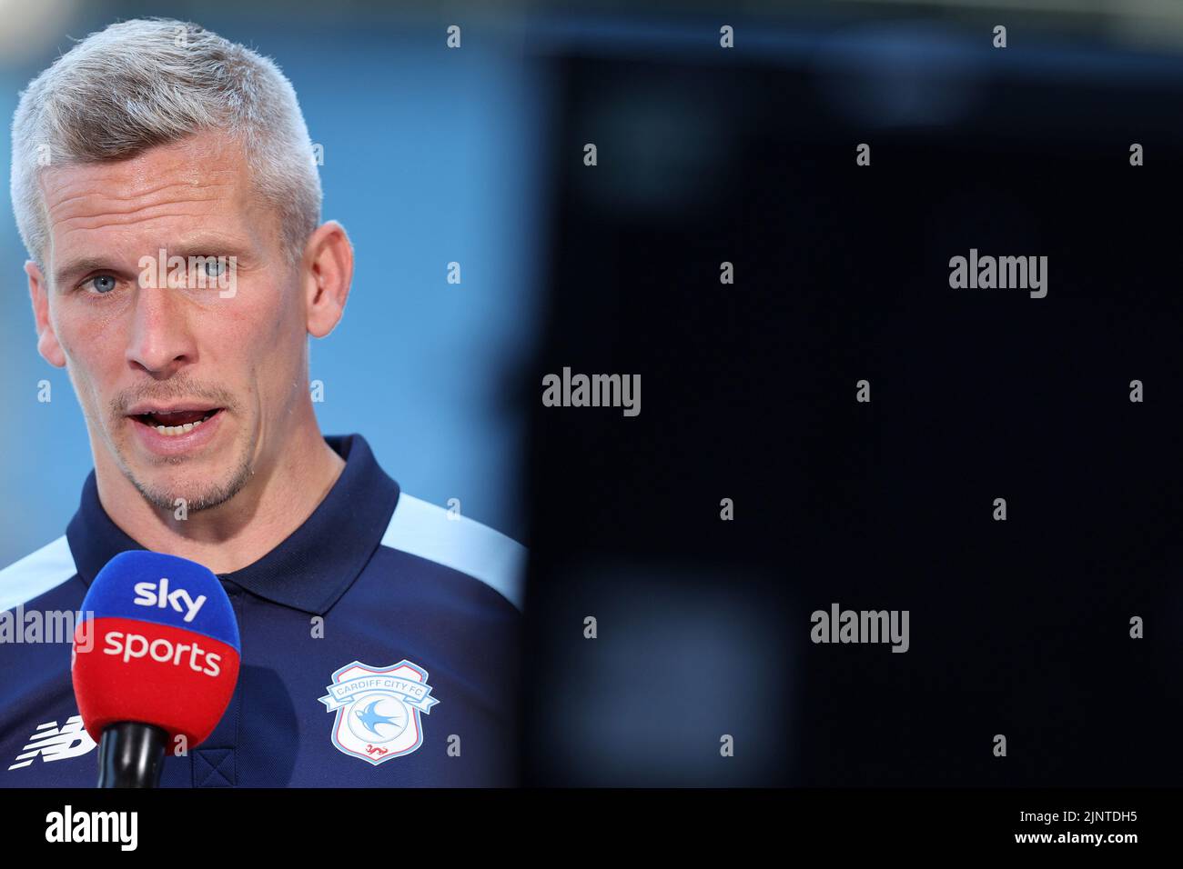 Cardiff, UK. 13th Aug, 2022. Steve Morison, the manager of Cardiff City looks on while interviewed by SKY Sports TV. EFL Skybet championship match, Cardiff city v Birmingham City at the Cardiff City Stadium in Cardiff, Wales on Saturday 13th August 2022. this image may only be used for Editorial purposes. Editorial use only, license required for commercial use. No use in betting, games or a single club/league/player publications. pic by Andrew Orchard/Andrew Orchard sports photography/Alamy Live news Credit: Andrew Orchard sports photography/Alamy Live News Stock Photo