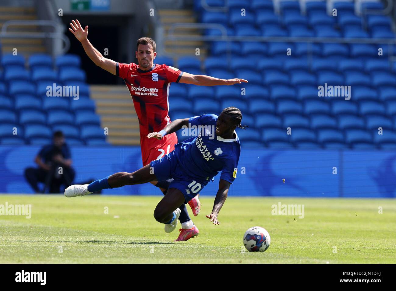 Cardiff, UK. 13th Aug, 2022. Sheyi Ojo of Cardiff City is fouled by Maxime Colin of Birmingham City (l). EFL Skybet championship match, Cardiff city v Birmingham City at the Cardiff City Stadium in Cardiff, Wales on Saturday 13th August 2022. this image may only be used for Editorial purposes. Editorial use only, license required for commercial use. No use in betting, games or a single club/league/player publications. pic by Andrew Orchard/Andrew Orchard sports photography/Alamy Live news Credit: Andrew Orchard sports photography/Alamy Live News Stock Photo