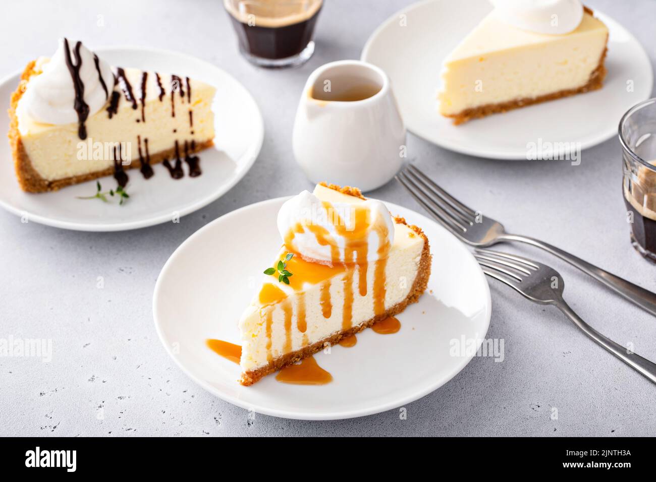 Classic New York cheesecake with a dollop of whipped cream Stock Photo