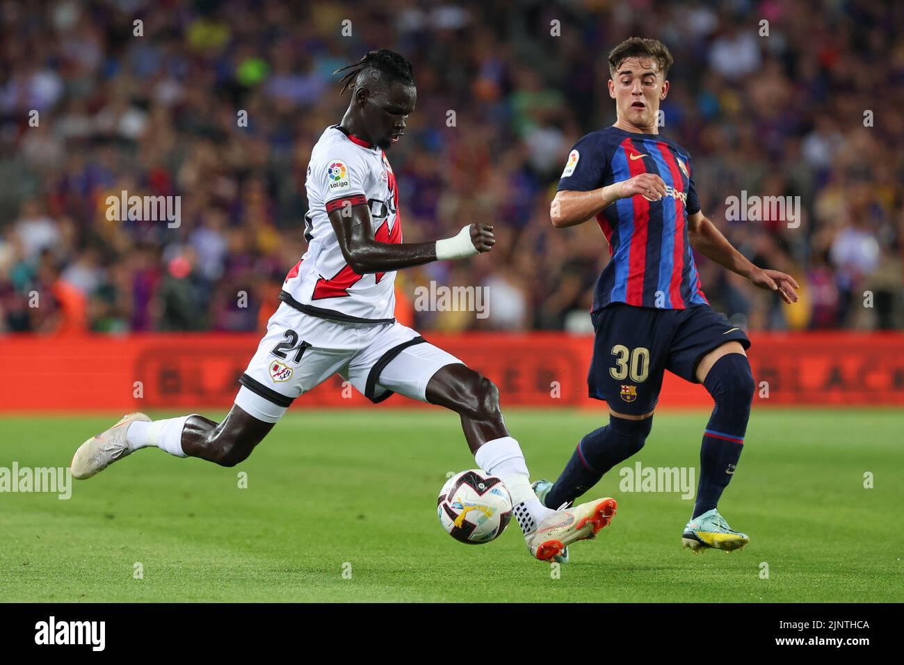 Pathe Ciss of Rayo Vallecano in action with Gavi of FC Barcelona during the Liga match between FC Barcelona and Rayo Vallecano at Spotify Camp Nou in Barcelona, Spain. Stock Photo