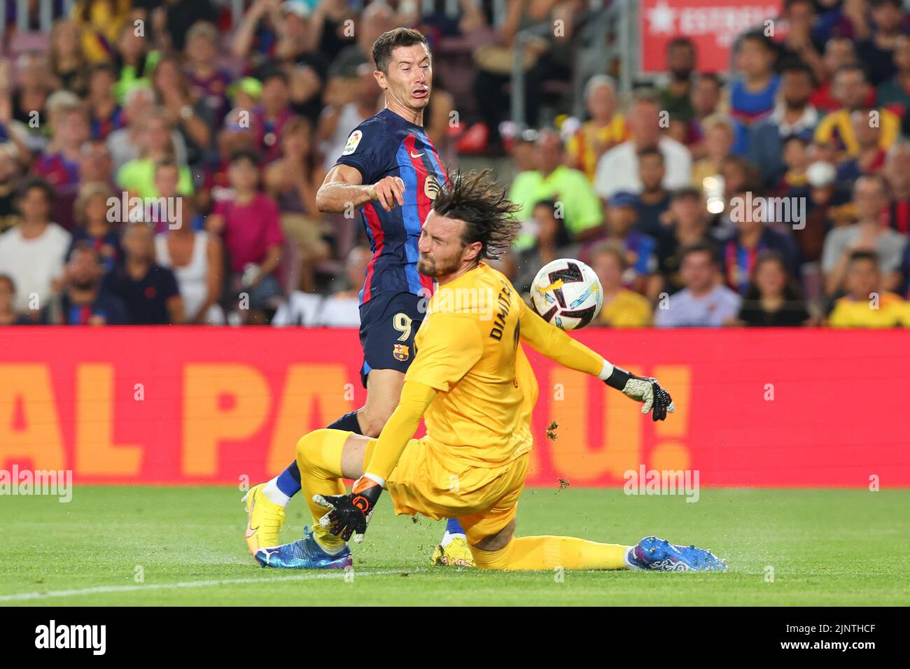 Robert Lewandowski of FC Barcelona in action with Stole Dimitrievski of Rayo Vallecano during the Liga match between FC Barcelona and Rayo Vallecano at Spotify Camp Nou in Barcelona, Spain. Stock Photo