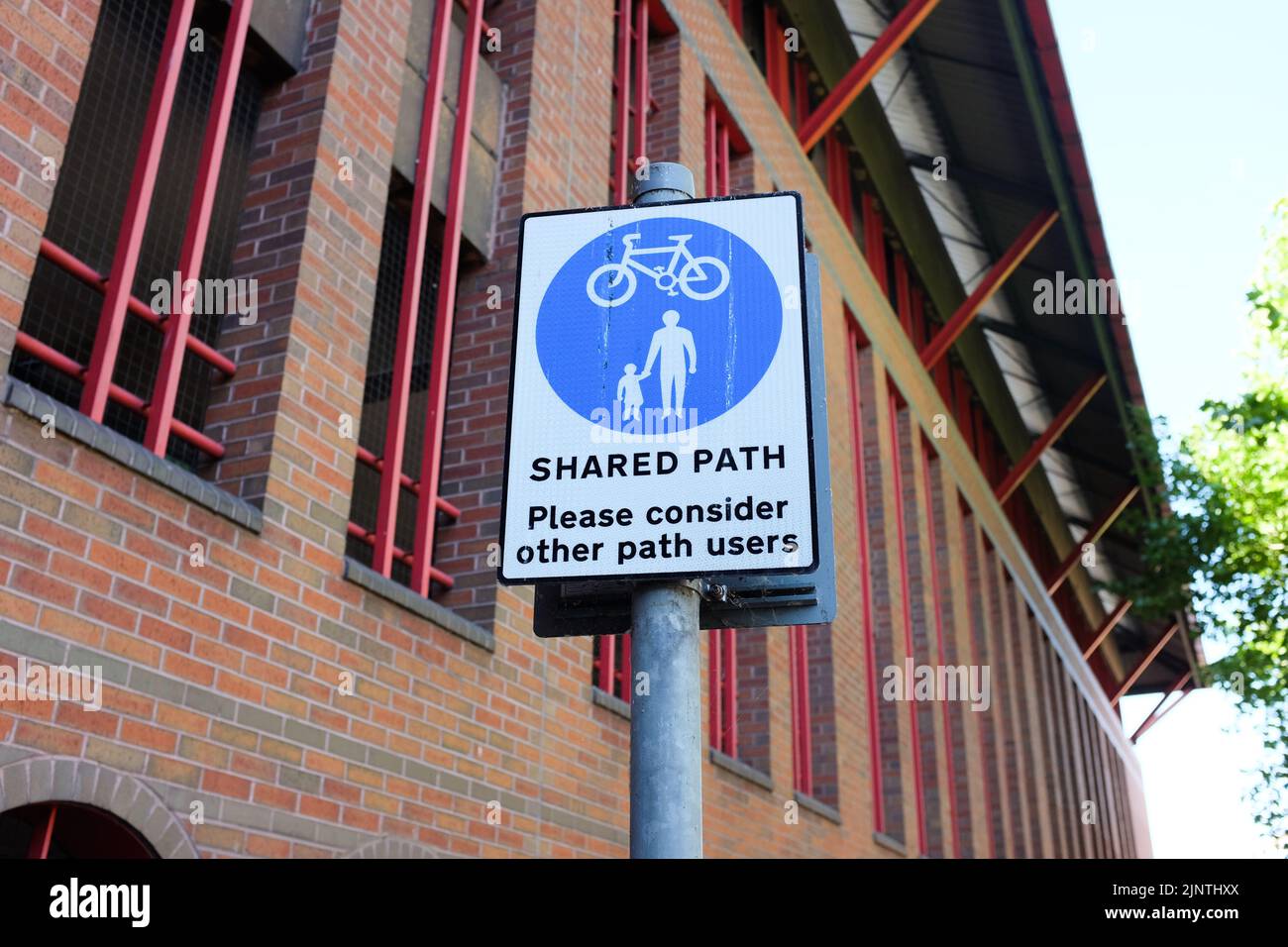 A 'shared path' sign, asking cyclists and pedestrians to use it with consideration. Stock Photo