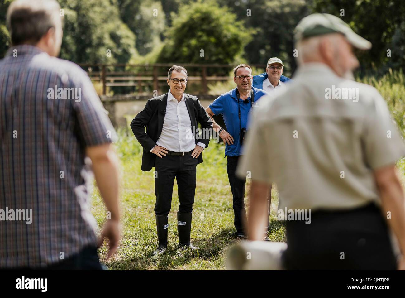 Templin, Deutschland. 27th July, 2022. (LR) Cem Oezdemir (Alliance 90/The Greens), Federal Minister of Agriculture and Food, and Leif Miller, NABU Federal Managing Director, photographed during a visit to a wet meadow near Templin, July 27, 2022. Credit: dpa/Alamy Live News Stock Photo