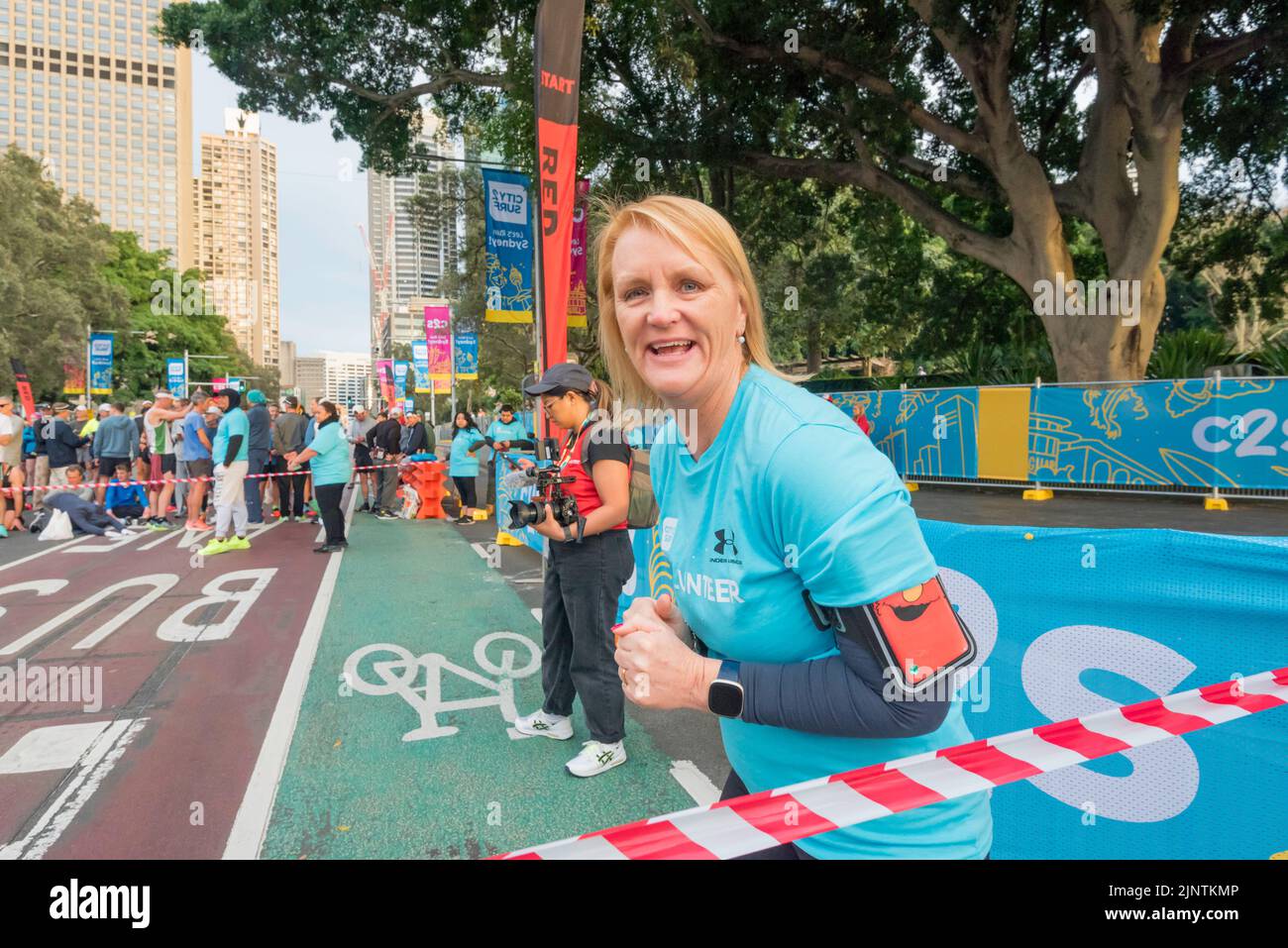Sydney, Australia, 14 August 2022: Some 60,000+ people are taking part in the 50th City2Surf race in Sydney, the first since 2019 after cancellations in 2020 and 2021 due to Covid-19 restrictions. In the background of every race are volunteers who help the event run smoothly. Pictured, Jodie Chilvers, a Senior Girl Guides leader who, with other Guides, has for many years collected discarded runner’s pre-start outer-clothing that is later donated to charities. Credit: Stephen Dwyer / Alamy Live News Stock Photo