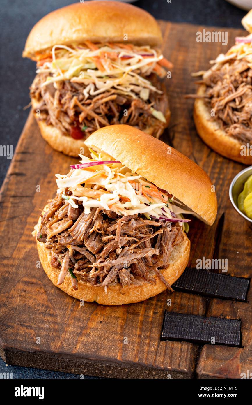 Pulled pork sandwiches with cole slaw on brioche buns Stock Photo - Alamy