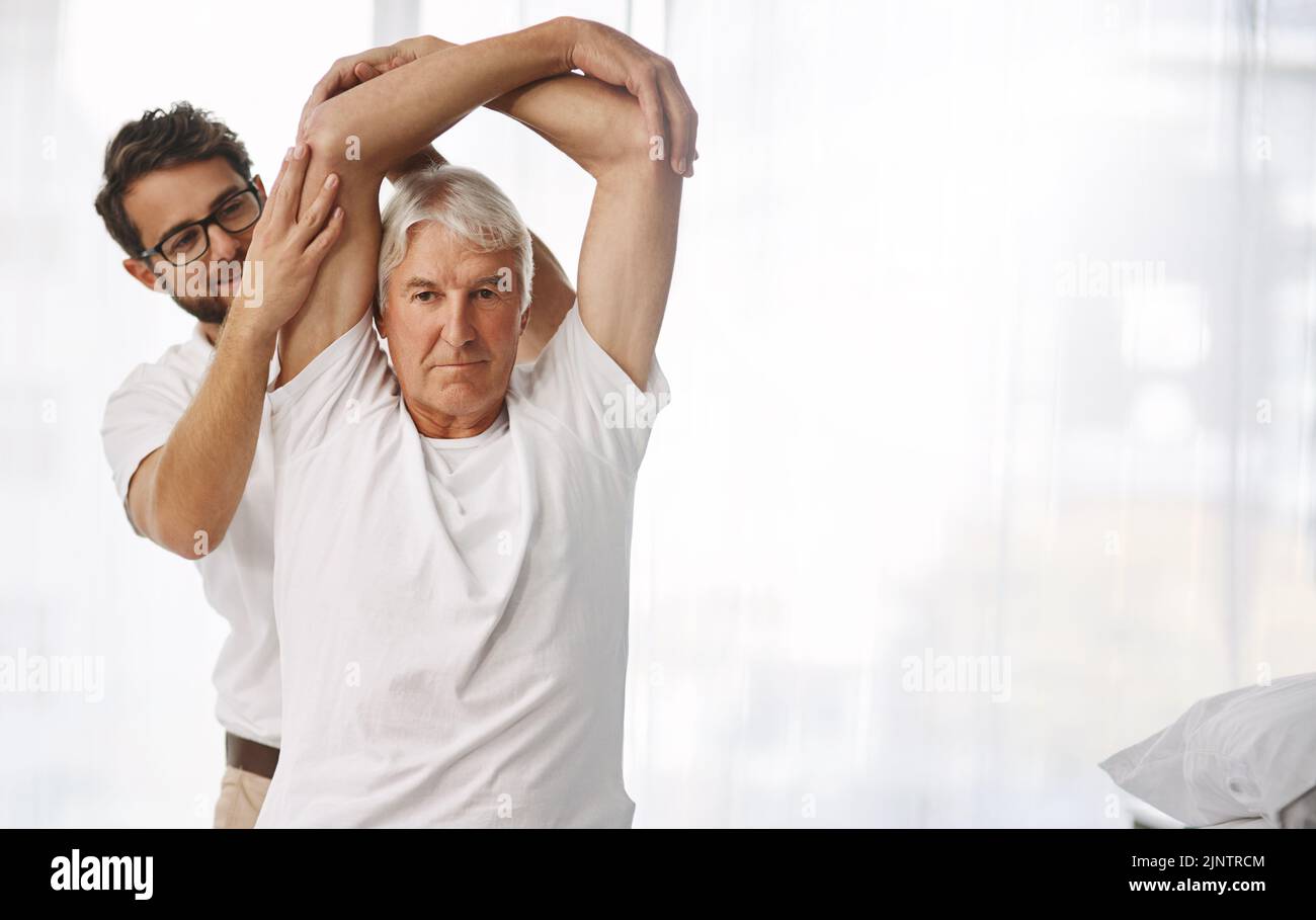 Your mobility seems good. a young male physiotherapist working with a