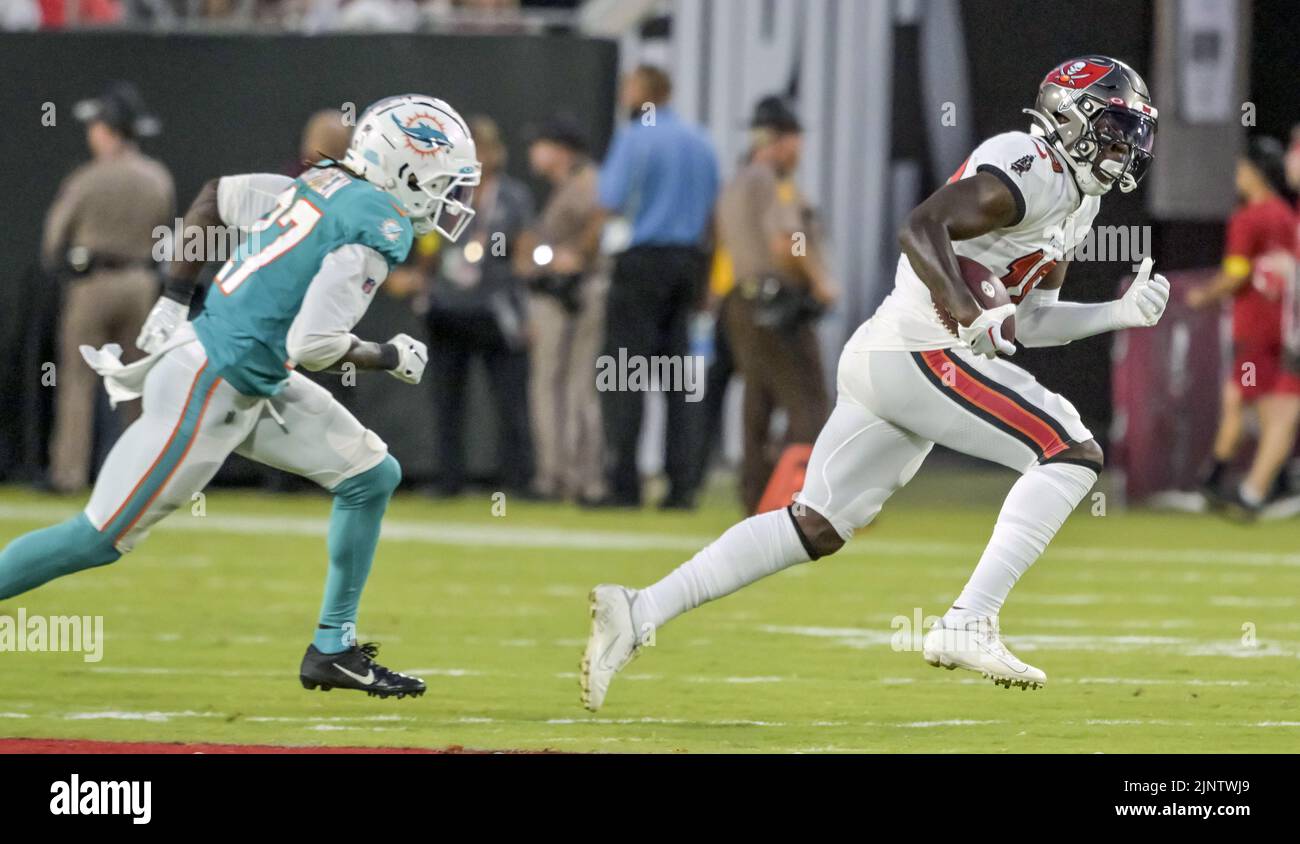 Tampa, United States. 13th Aug, 2022. Miami Dolphins' Keion Crossen (L) chases Tampa Bay Buccaneers wide receiver Tyler Johnson (R) during the first half of their preseason game at Raymond James Stadium in Tampa, Florida on Saturday, August 13, 2022. Photo by Steve Nesius/UPI Credit: UPI/Alamy Live News Stock Photo