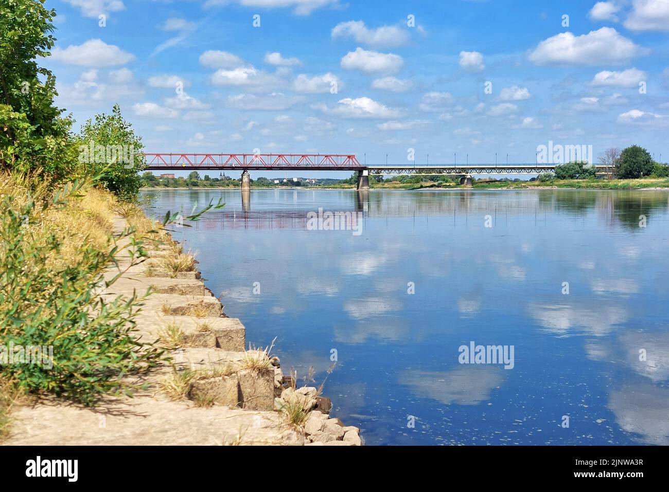 Riverside and steel frame bridge over the river Elbe in Schoenebeck, Saxony-Anhalt, Germany. Stock Photo
