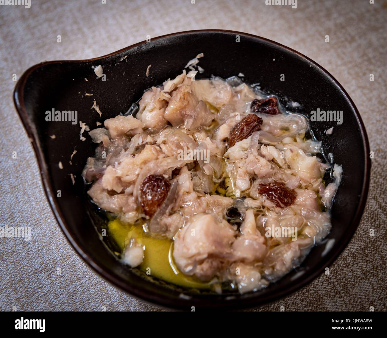 specialties like 'sarde in saor', typical Venetian dish. traditional appetizer with sardines, pine nuts and sultanas Stock Photo