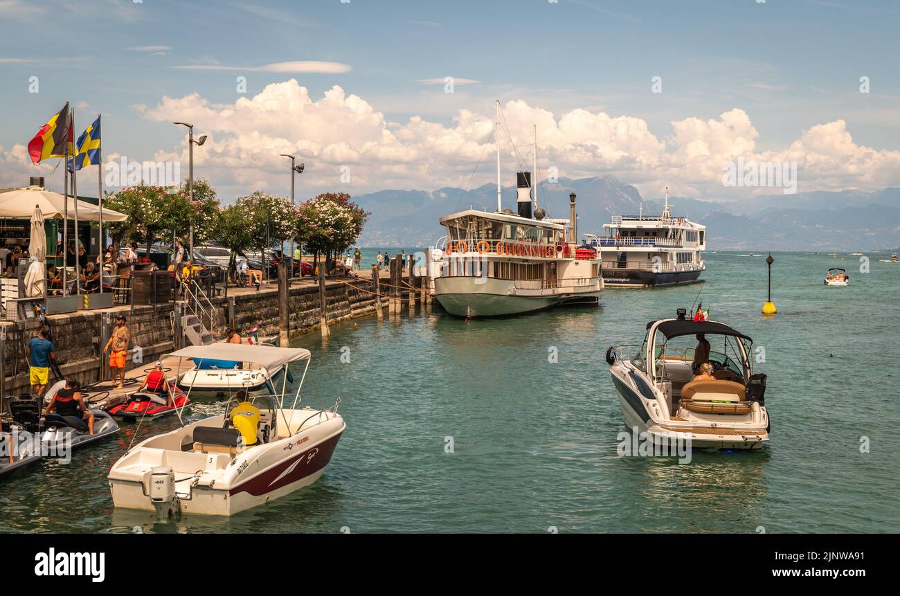 Peschiera del Garda town. Little town Harbour with colorful boats. Italian Garda lake, Veneto region of northern Italy - Charming fortified citadel Stock Photo