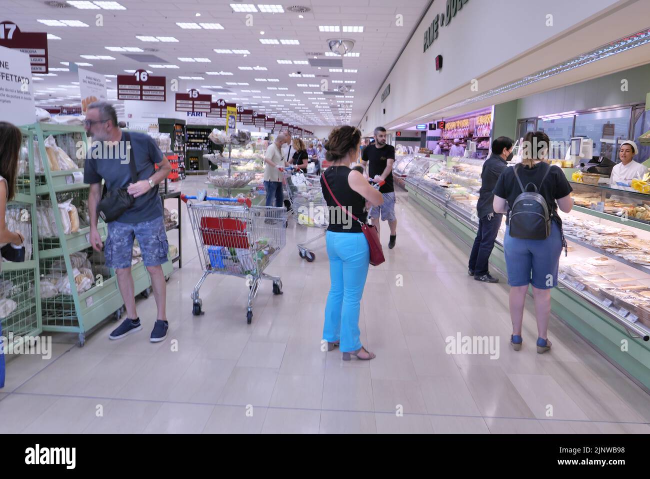 PEOPLE WITH SHOPPING CART INSIDE A FOOD MEGA STORE Stock Photo Alamy