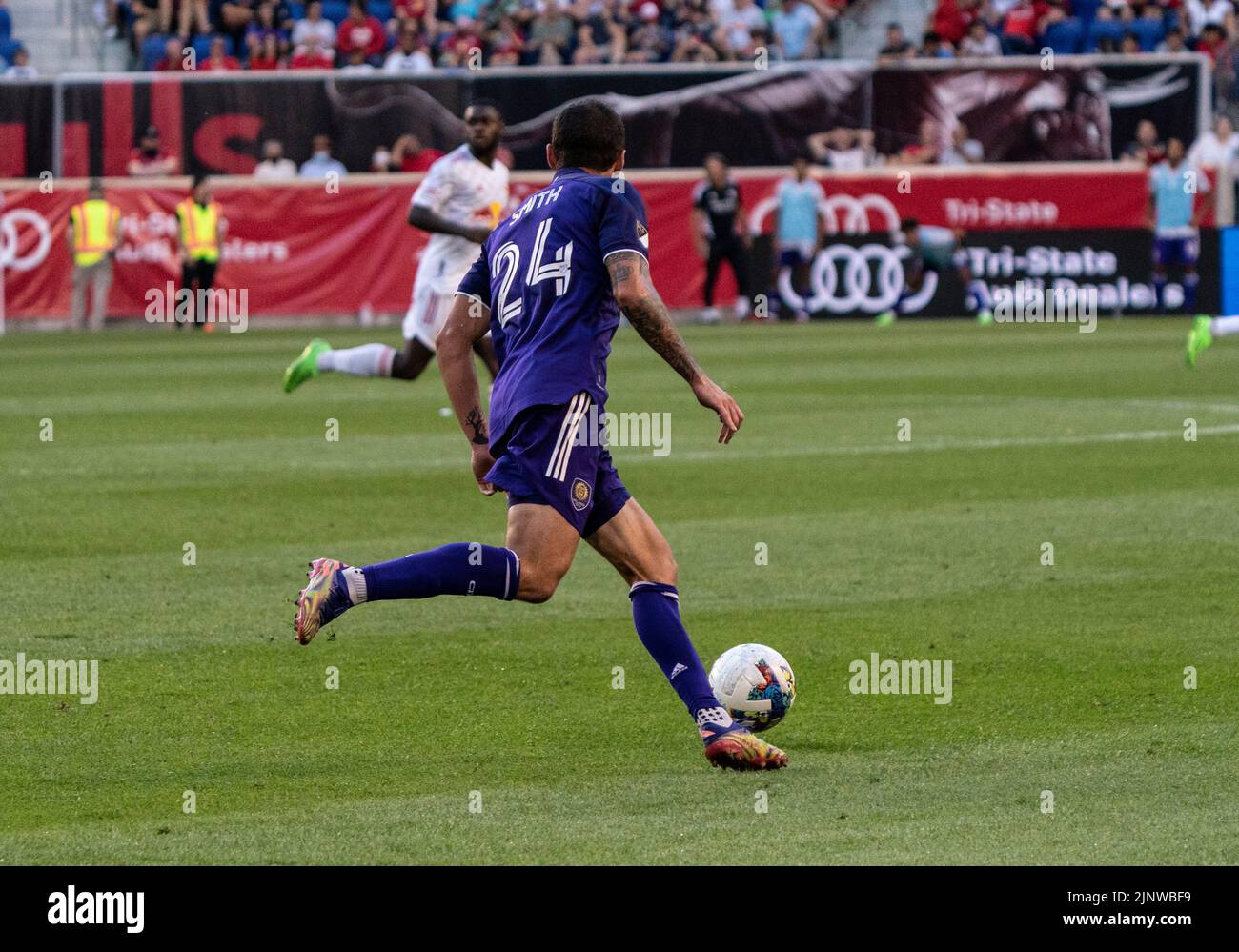 Harrison, NJ - August 13, 2022: Kyle Smith (24) of Orlando FC controls ball during MLS regular season game against Red Bulls at Red Bull Arena Stock Photo