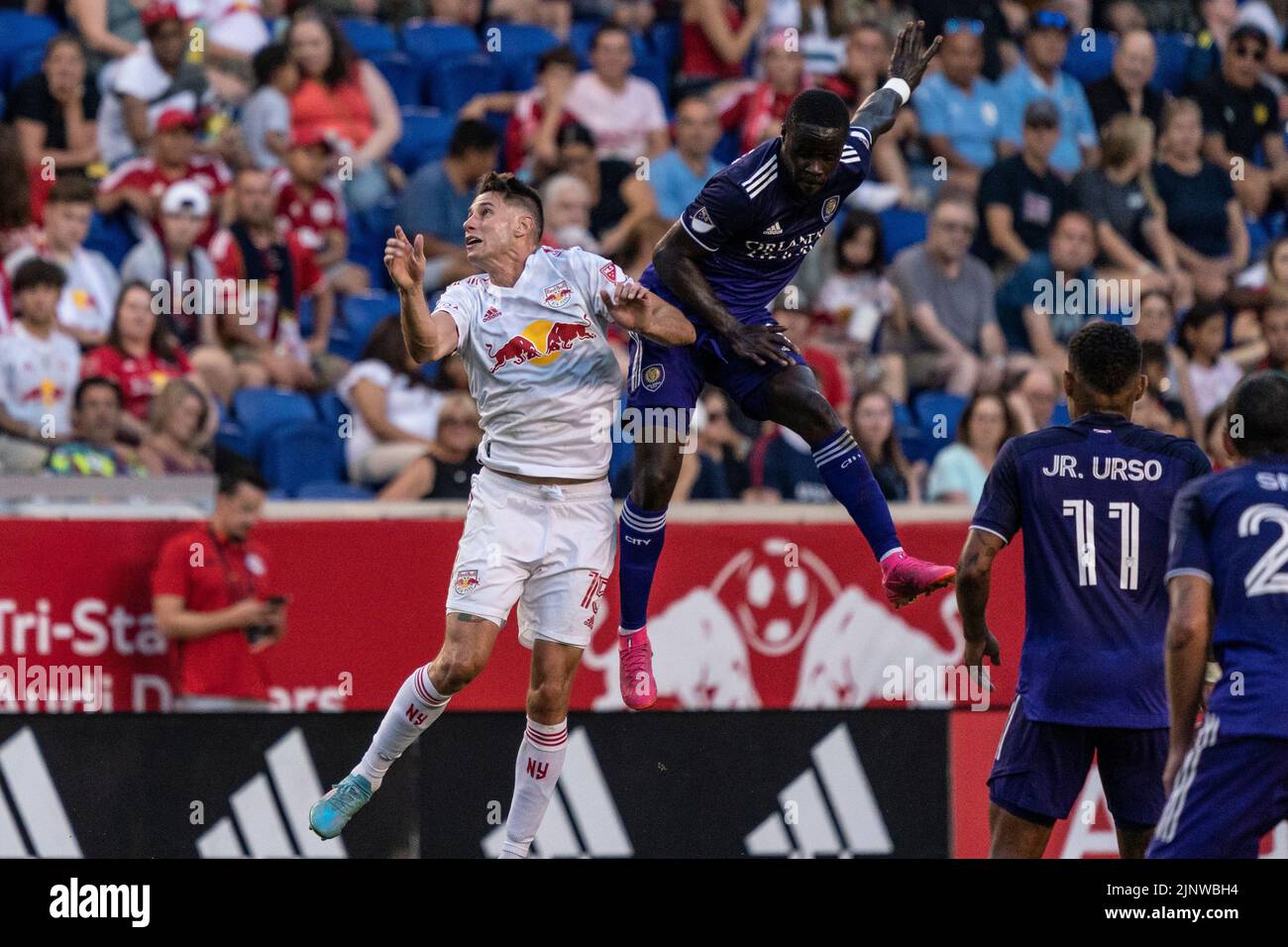 Harrison, NJ - August 13, 2022: Sean Nealis (15) of Red Bulls and Benji Michel (19) of Orlando fight for ball during MLS regular season game at Red Bull Arena Stock Photo