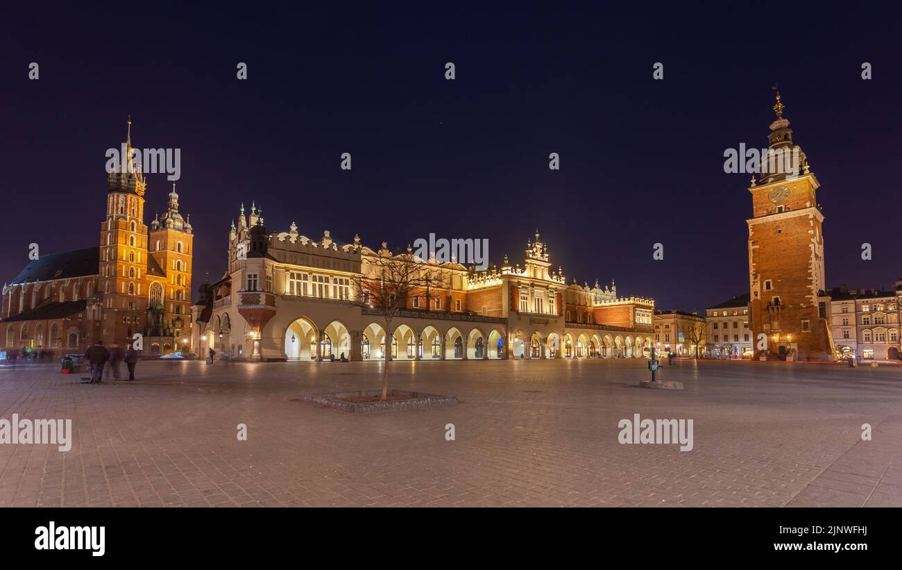 Old town square in Krakow at night, Poland. St. Marys Basilica. Travel