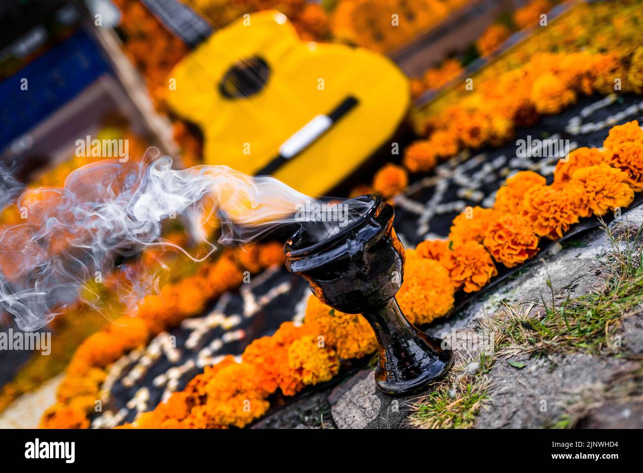 An incense burner is seen smoking at the altar of the dead during the Day of the Dead celebrations in Taxco, Mexico. Stock Photo