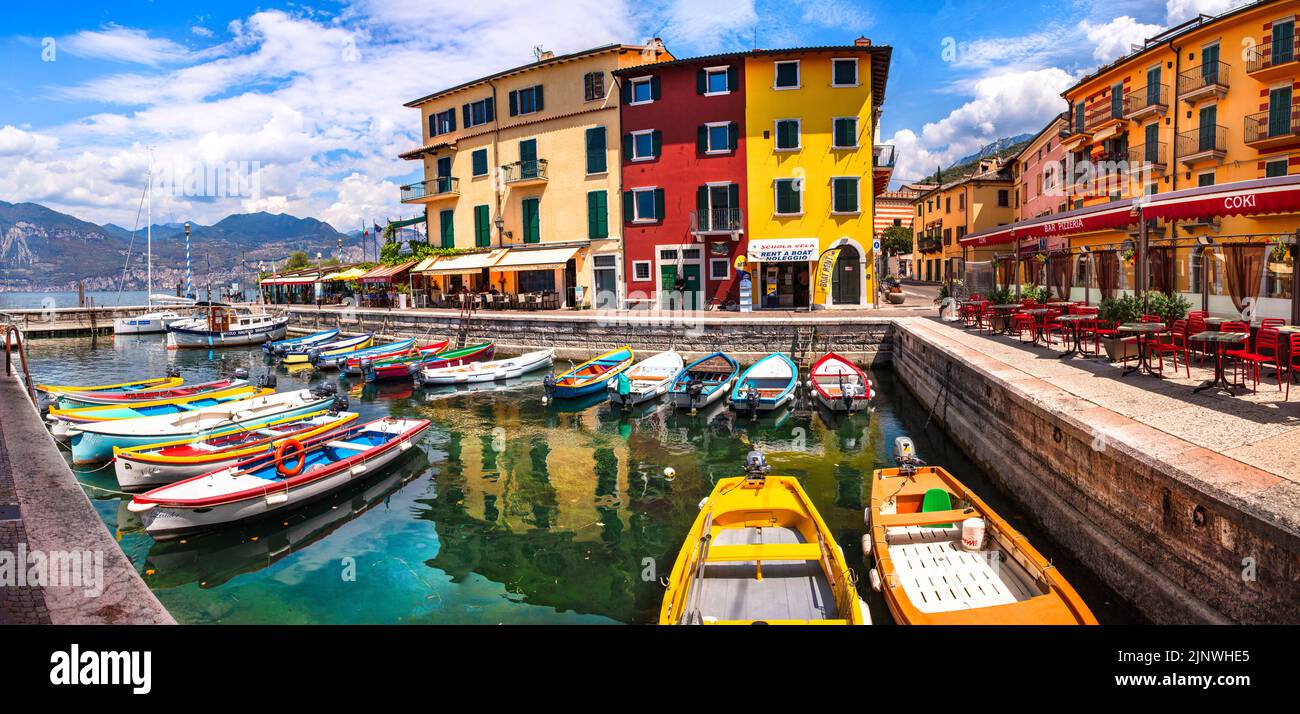 Scenic Lake Lago di Garda, Italy, Charming fishing village with colorful houses and boats - Castelletto di Brenzone. 28/07/2022 Stock Photo