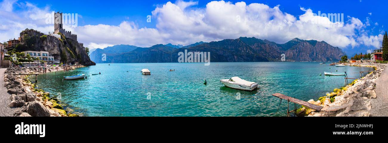 Amazing italian lakes scenery - beautiful Lago di Garda. panoramic view of Malcesine castle and beach Stock Photo