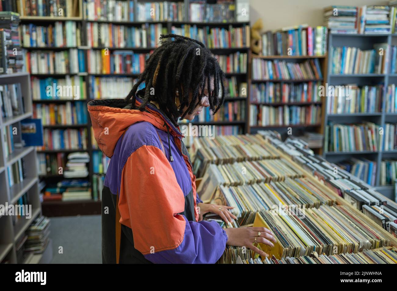 Woman buying vinyl records at local store Stock Photo Alamy