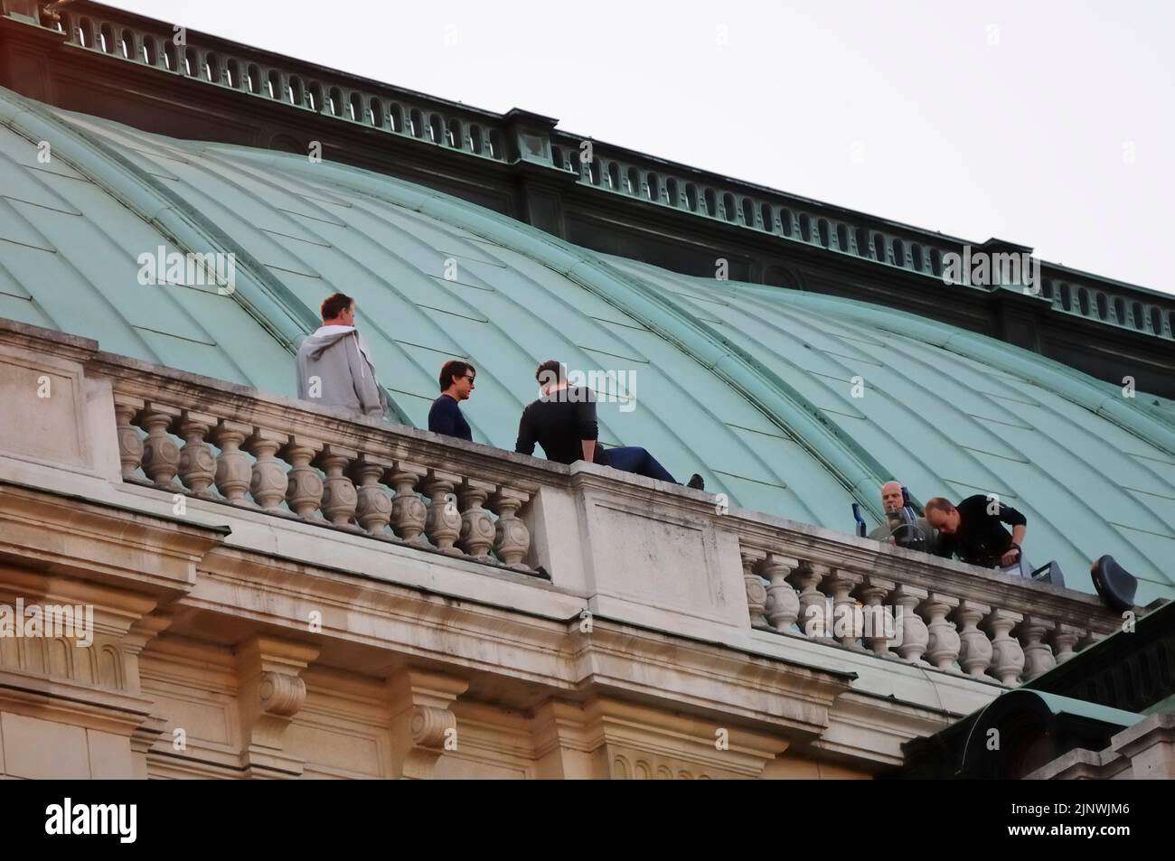 Vienna, Austria. August 28, 2014. Filming for Mission: Impossible 5 at the Vienna State Opera with Tom Cruise (2nd from L)  and Christopher McQuarrie (3rd from L) Stock Photo