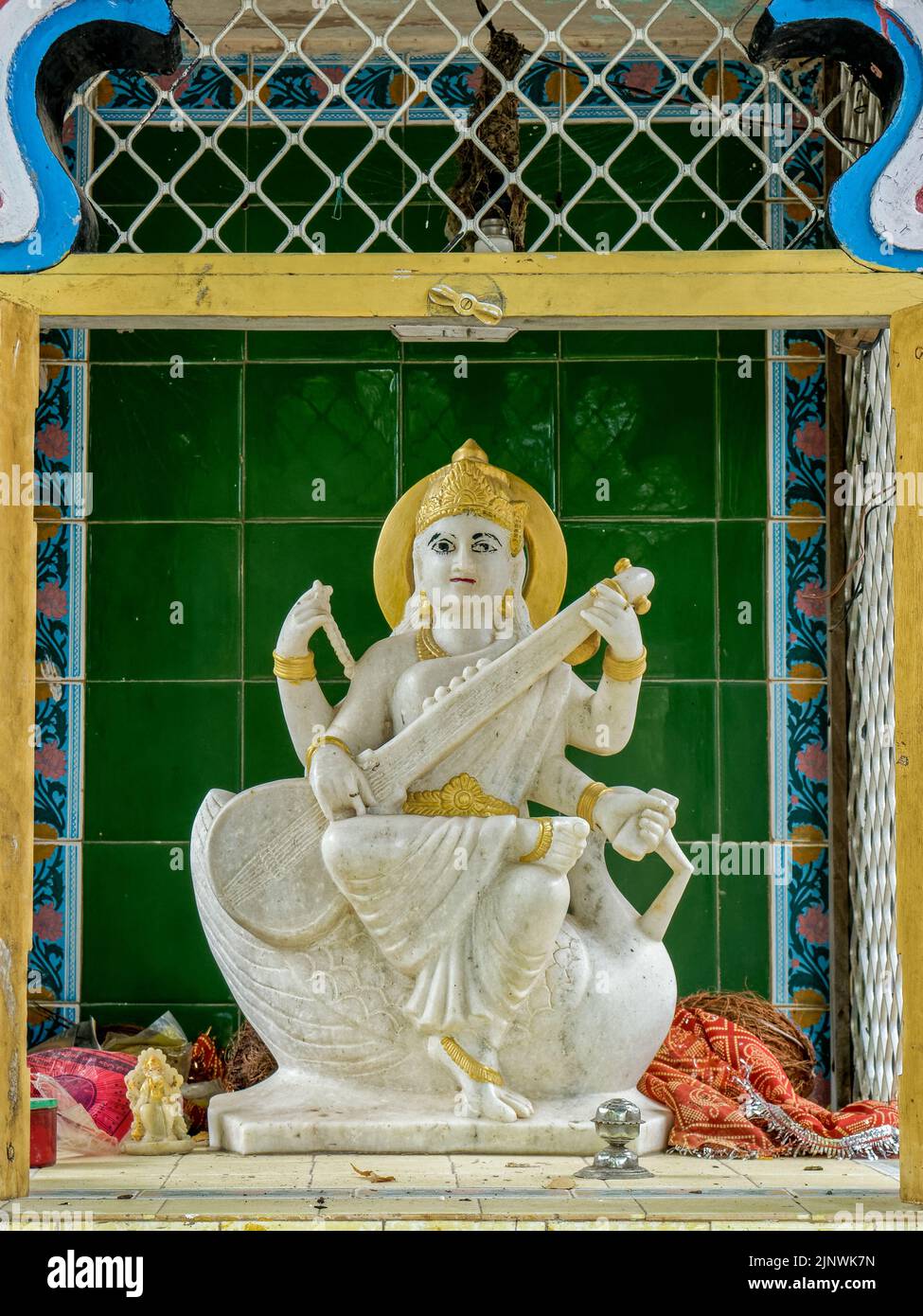 03 Nov 2019 Vintage Marble statue of Devi Saraswati Goddess of Knowledge inside compound of school Bhiloda Aravalli District Gujarat India Stock Photo