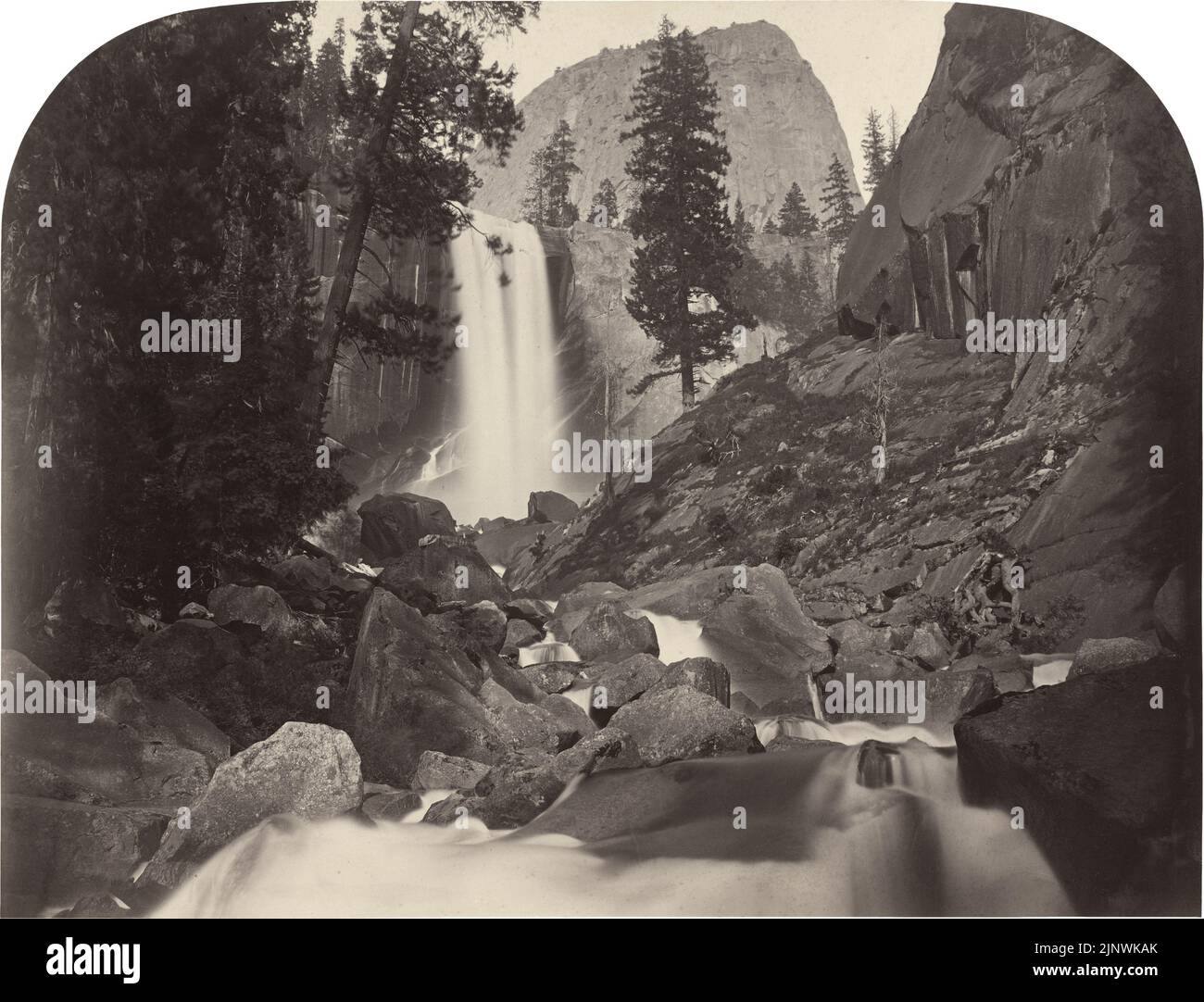 'Carleton E. Watkins, Piwyac, Vernal Fall, 300 feet, Yosemite, 1861, albumen print from collodion negative mounted on paperboard, sheet (trimmed to image): 39.9 x 52.3 cm (15 11/16 x 20 9/16 in.) mount: 53.2 x 68.7 cm (20 15/16 x 27 1/16 in.)  mat: 66 x 76.1 cm (26 x 29 15/16 in.), Gift of Mary and David Robinson, 1995.35.23' Stock Photo