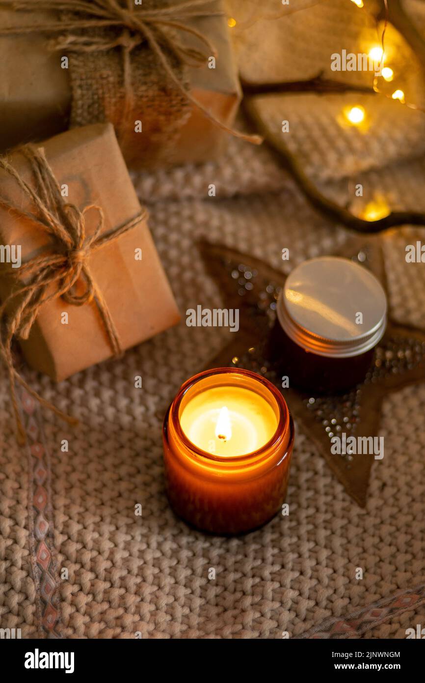 A set of different aroma candles in brown glass jars. Scented handmade ...