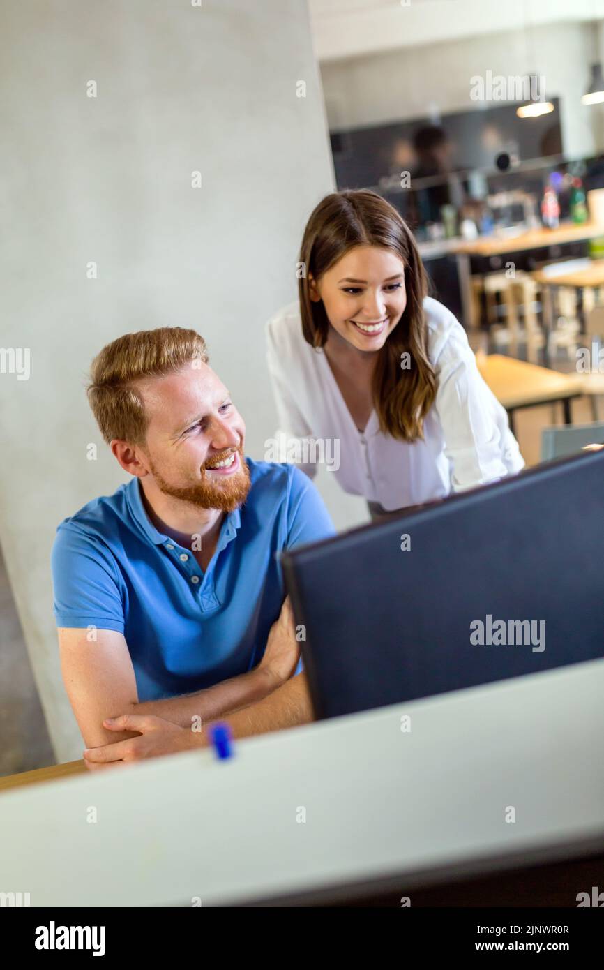 Colleagues developing software together hi-res stock photography and ...