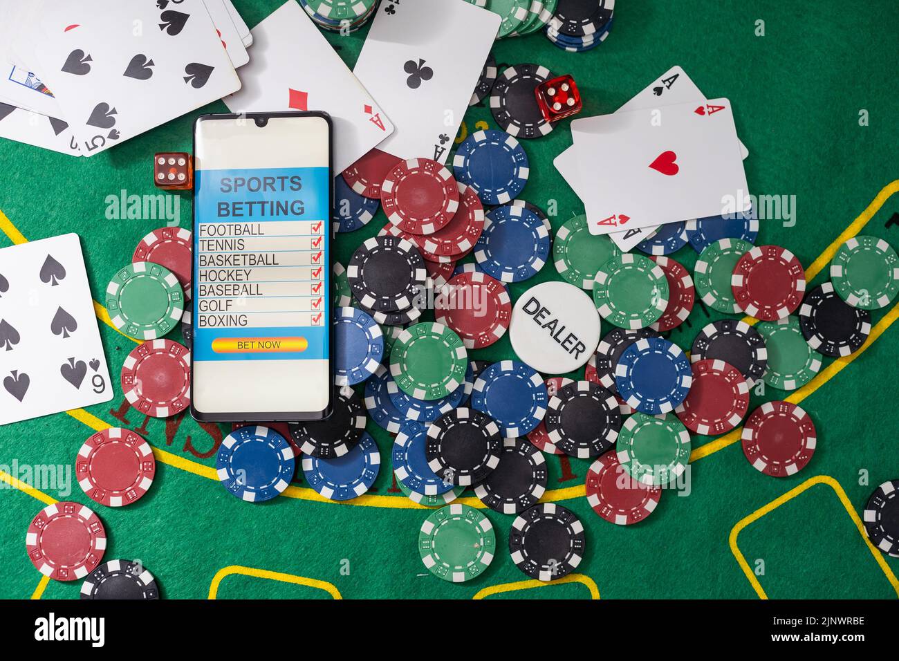 Smartphone with poket table on screen, playing cards and chip cards on ...