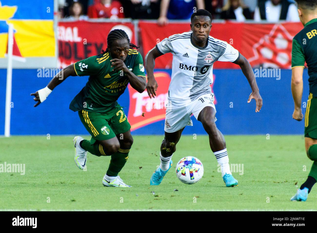 Toronto, Canada. 13th Aug, 2022. Richie Laryea (10) and Yimmi Chara (23) in action during the MLS game between Toronto FC and Portland Timbers SC at BMO field. The game ended 3-1 for Toronto FC. Credit: SOPA Images Limited/Alamy Live News Stock Photo